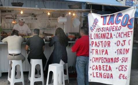 Judge a place by how many people are eating the food that comes from inside!