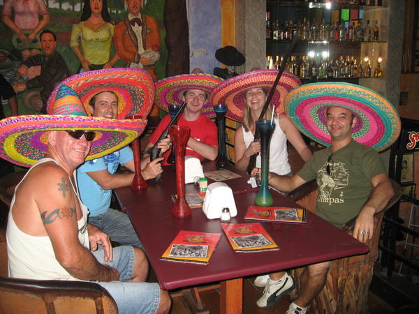 993553-drinking-a-yard-of-beer-each-at-a-bar--merida-mexico-0