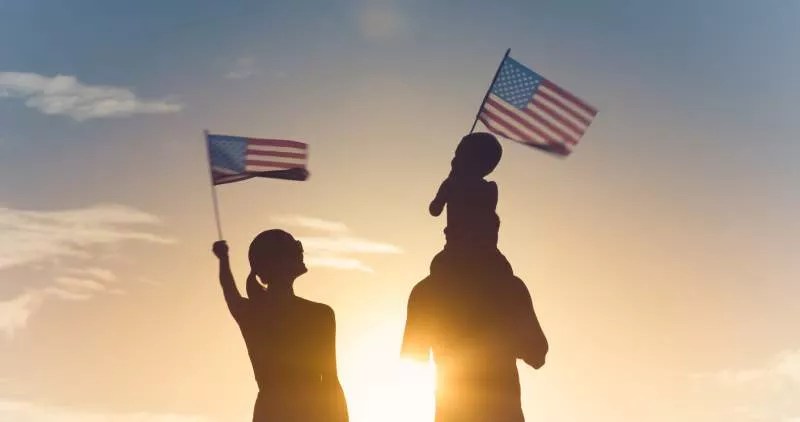 family-celebrates-nationalization-with-american-flags